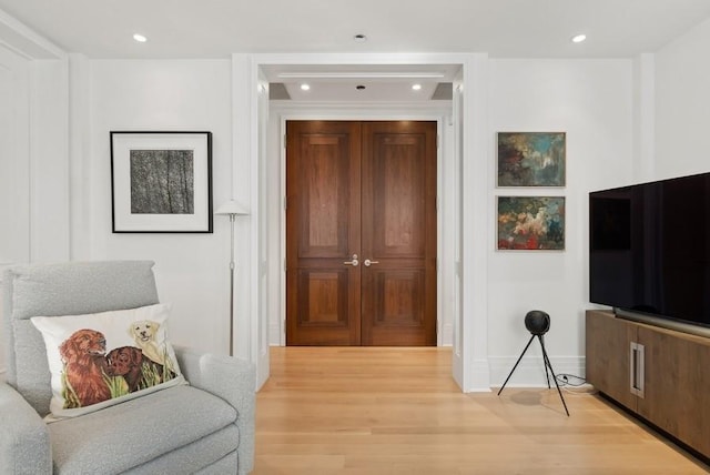 sitting room with hardwood / wood-style floors