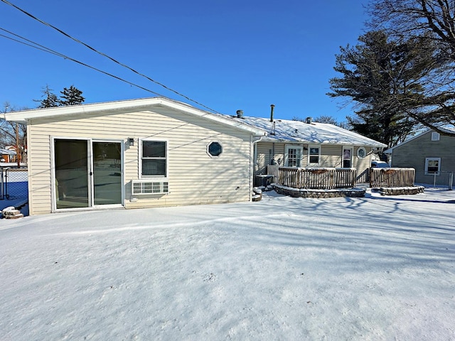 rear view of house featuring a deck