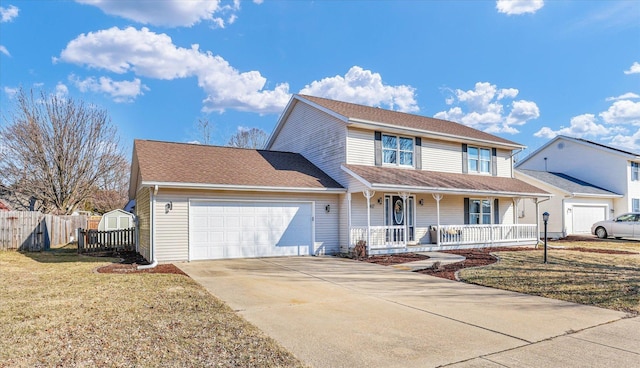 traditional-style home featuring a garage, concrete driveway, covered porch, fence, and a front yard