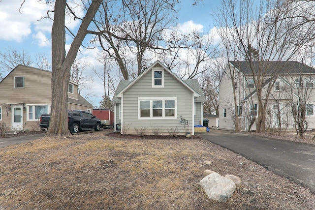 view of front of home featuring roof with shingles