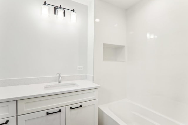 bathroom featuring a bathtub, a shower, and vanity