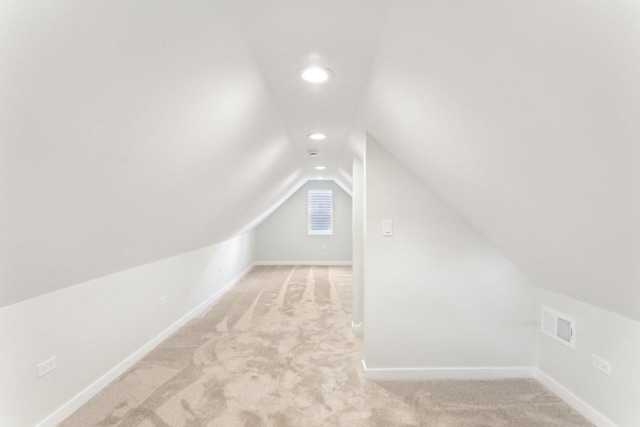 bonus room with recessed lighting, light colored carpet, visible vents, vaulted ceiling, and baseboards