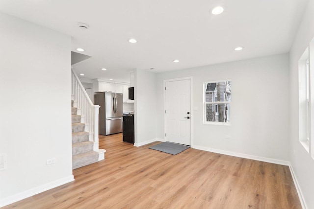 foyer entrance with stairs, baseboards, light wood-style flooring, and recessed lighting