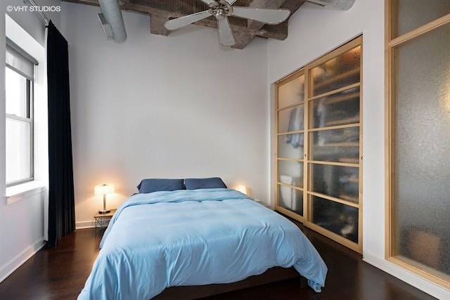 bedroom featuring dark wood-type flooring and ceiling fan