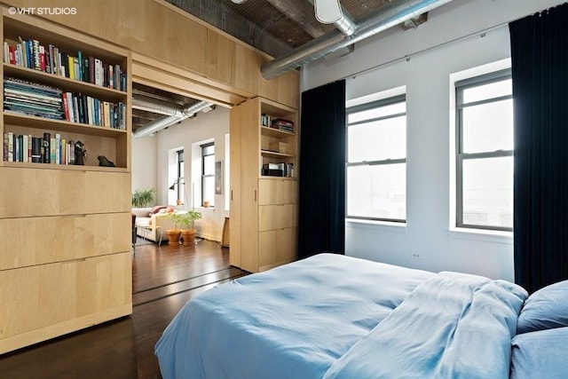 bedroom featuring dark hardwood / wood-style flooring