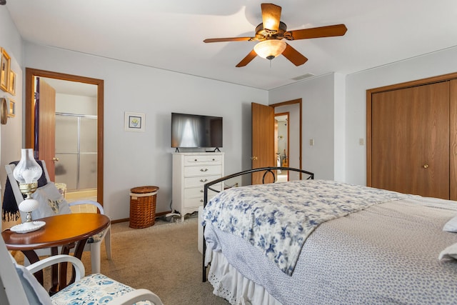 carpeted bedroom featuring a ceiling fan, a closet, visible vents, and baseboards