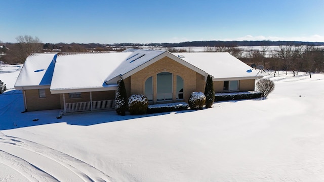 view of front of home featuring brick siding