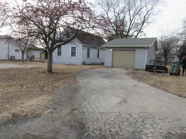 ranch-style house with an outbuilding and a garage