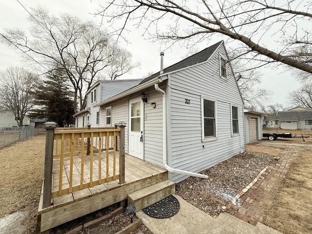 view of side of property with a deck