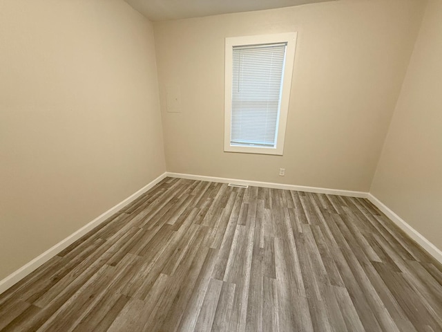 spare room featuring hardwood / wood-style flooring