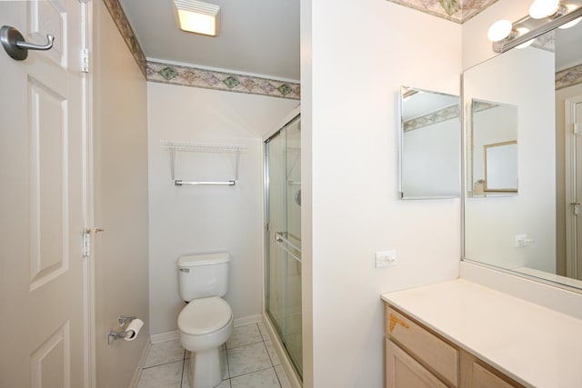 bathroom with vanity, tile patterned flooring, a shower stall, and toilet