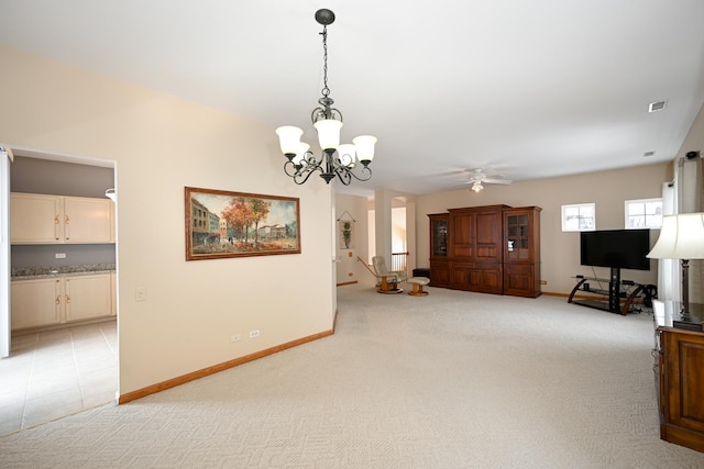 living room with light carpet, an inviting chandelier, visible vents, and baseboards