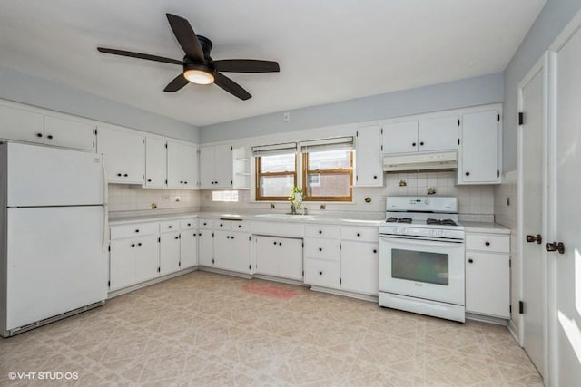 kitchen featuring white cabinetry, backsplash, white appliances, and sink