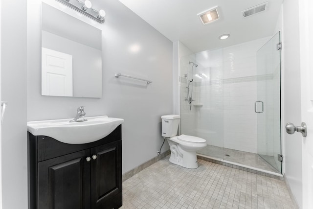 bathroom with walk in shower, tile patterned floors, vanity, and toilet