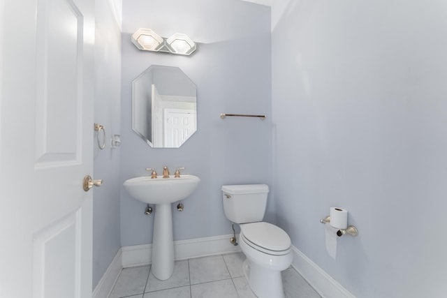 bathroom featuring tile patterned floors and toilet