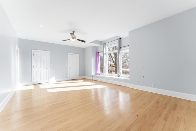 spare room featuring ceiling fan and light wood-type flooring