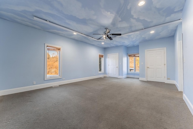 carpeted empty room with ceiling fan