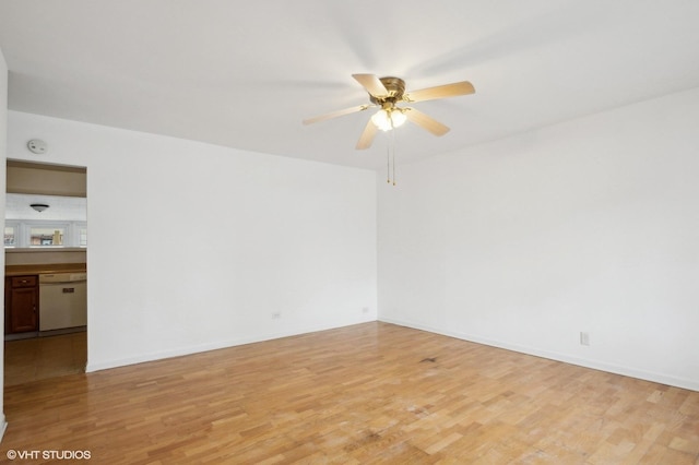 unfurnished room featuring ceiling fan and light wood-type flooring