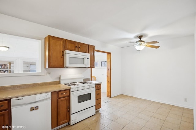 kitchen with ceiling fan, white appliances, and light tile patterned floors