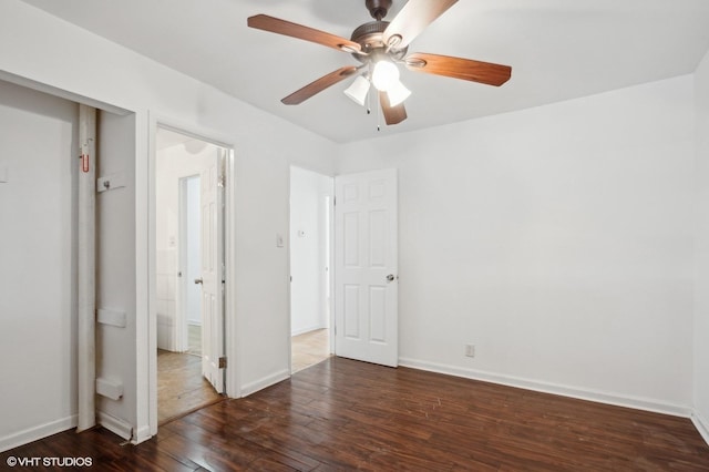 unfurnished bedroom featuring dark hardwood / wood-style flooring and ceiling fan