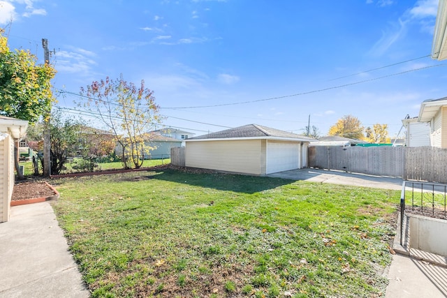 view of yard featuring an outbuilding and a garage