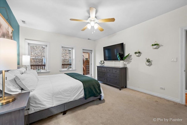 bedroom with carpet floors, a ceiling fan, visible vents, and baseboards