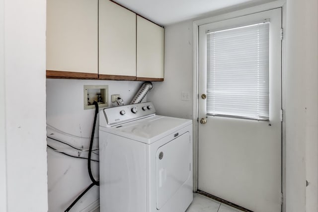 clothes washing area with cabinet space and washer / dryer