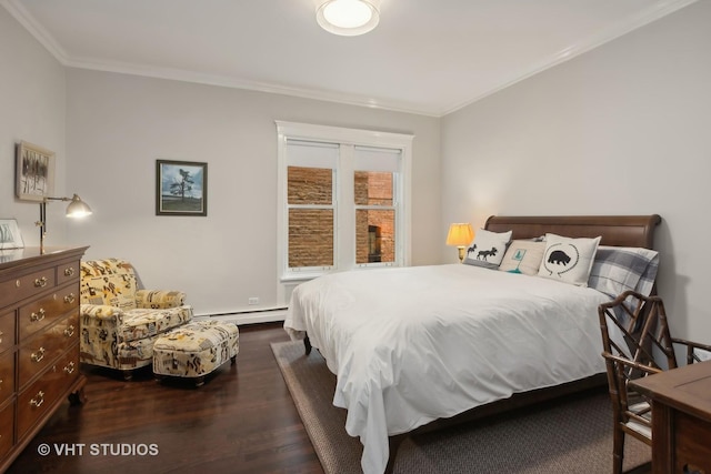 bedroom with ornamental molding, dark hardwood / wood-style floors, and a baseboard heating unit