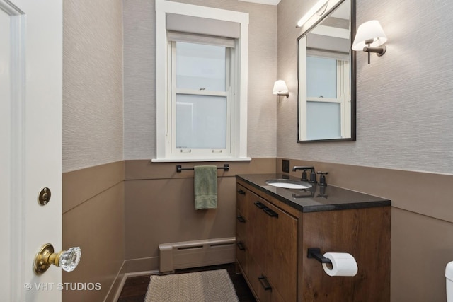 bathroom with a baseboard radiator and vanity