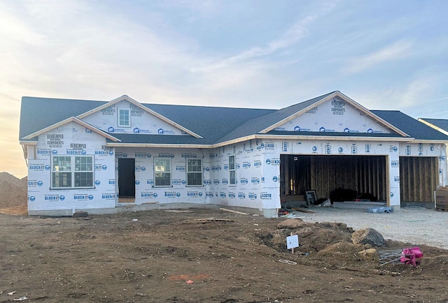 unfinished property featuring a garage