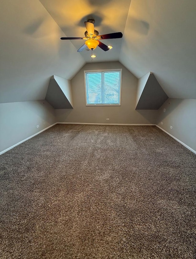 bonus room with lofted ceiling, carpet floors, and ceiling fan