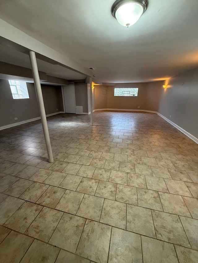 basement featuring light tile patterned floors