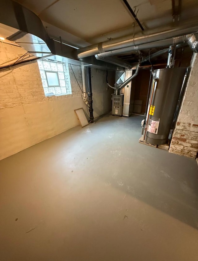 basement featuring heating unit and gas water heater