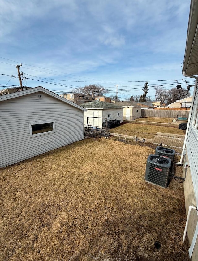 view of yard with central AC