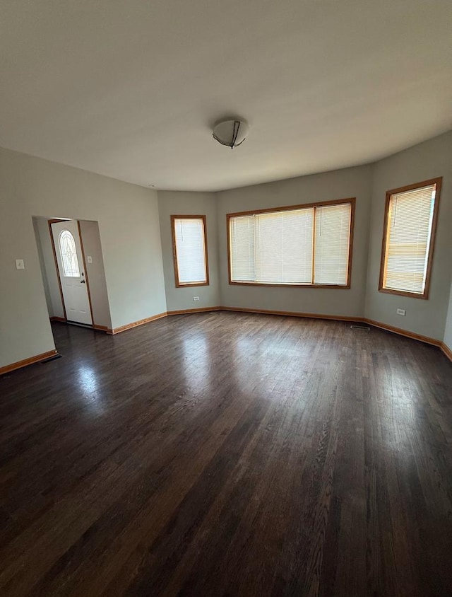 empty room featuring dark hardwood / wood-style floors