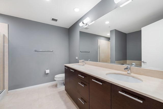 full bath with visible vents, a sink, toilet, and tile patterned floors