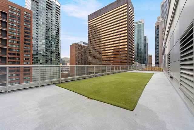 view of yard with a view of city and fence