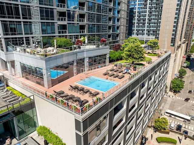 view of swimming pool with a city view