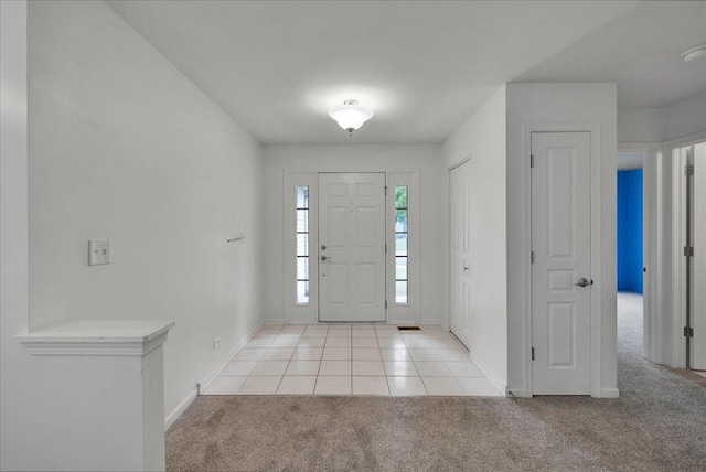 entryway featuring light colored carpet