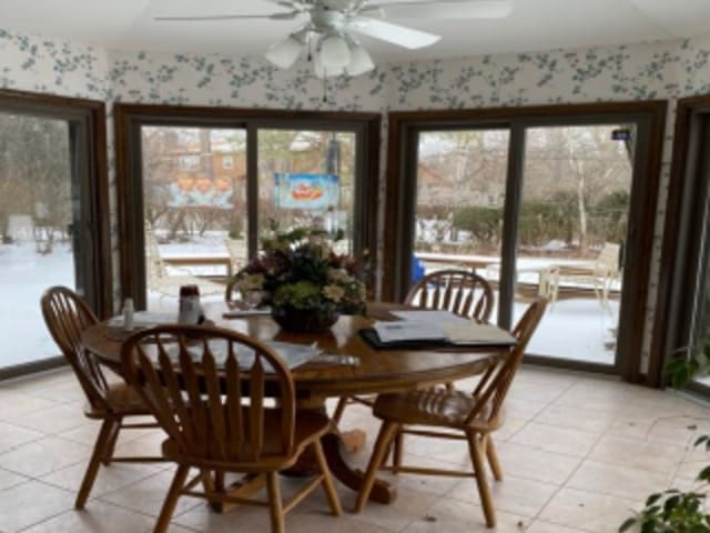 dining room featuring ceiling fan