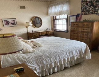 bedroom with light carpet