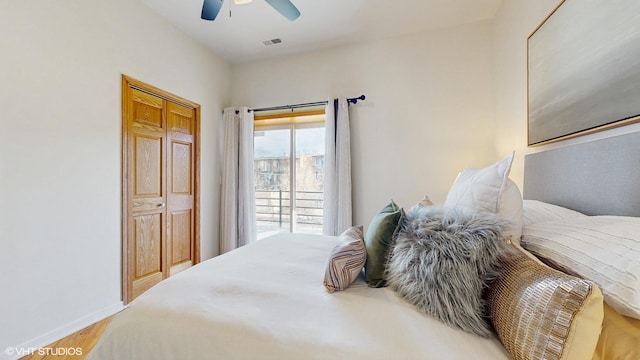 bedroom with visible vents, ceiling fan, light wood-style flooring, and baseboards