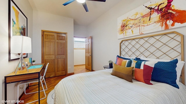 bedroom with ceiling fan, a closet, and wood finished floors