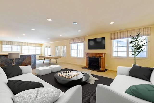 living area with recessed lighting, carpet flooring, a fireplace with flush hearth, baseboards, and visible vents