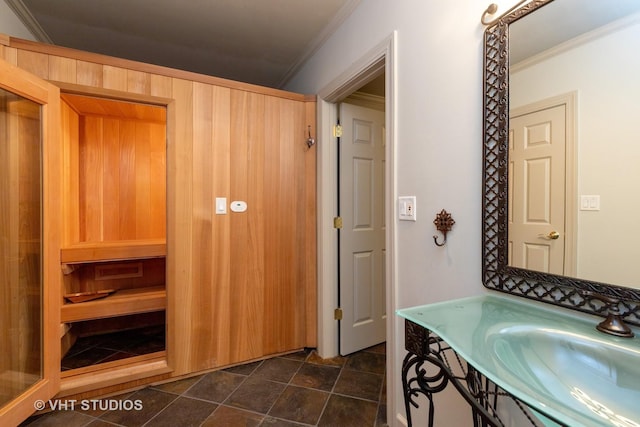 bathroom featuring a sauna, ornamental molding, and vanity