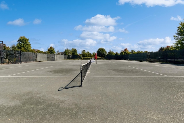 view of sport court featuring fence