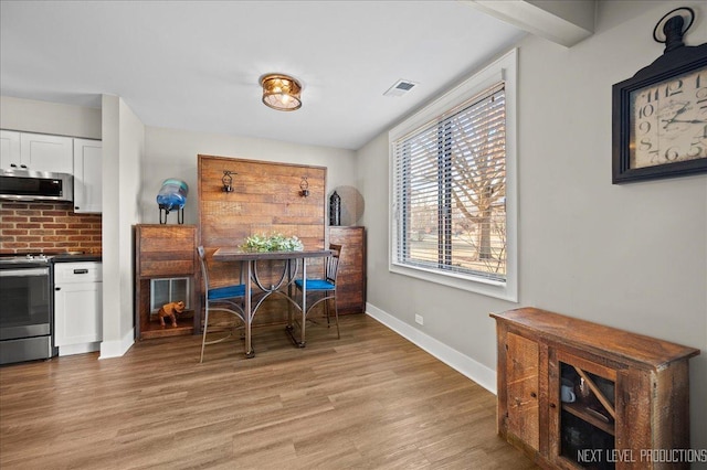 dining room with light hardwood / wood-style floors