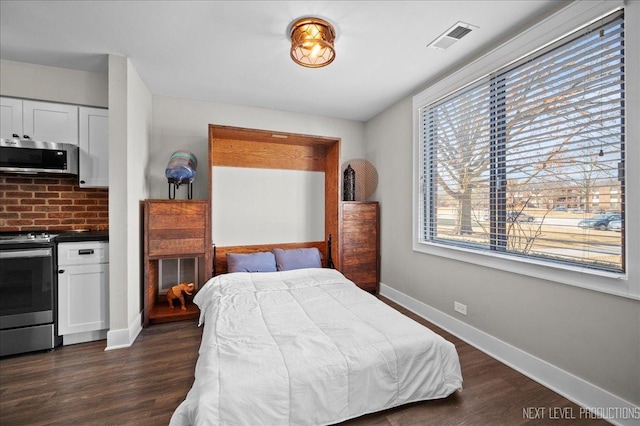 bedroom featuring dark hardwood / wood-style flooring