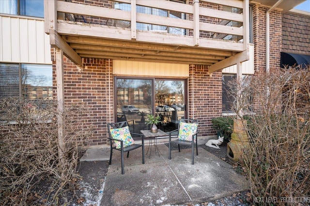 view of patio featuring a balcony