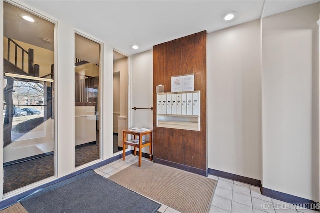 interior space featuring light tile patterned flooring and mail boxes